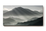 Sinus Art Wandbild 120x80cm Faszinierende Lichtstrahlen durchdringen den Morgennebel über mystischen Berglandschaften