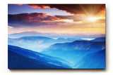 Sinus Art Wandbild 120x80cm Faszinierende Berglandschaft in verschiedenen Blauabstufungen mit goldener Sonne