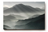 Sinus Art Wandbild 120x80cm Faszinierende Lichtstrahlen durchdringen den Morgennebel über mystischen Berglandschaften