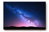 Sinus Art Wandbild 120x80cm Die Milchstraße spannt sich in leuchtenden Farben über eine dunkle Landschaft