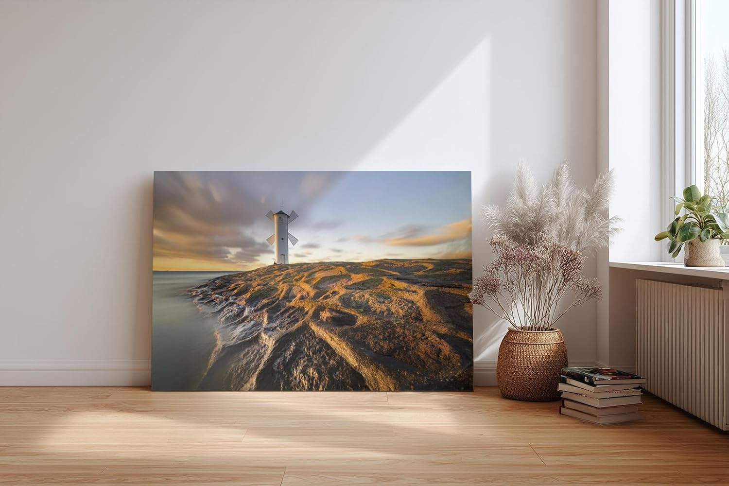 Sinus Art Wandbild 120x80cm Faszinierendes Motiv eines Leuchtturms auf strukturierten Felsen im Abendlicht