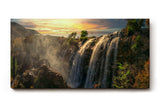 Sinus Art Wandbild 120x80cm Wasserfall-Szenerie im warmen Licht des Sonnenuntergangs mit lebendiger Vegetation