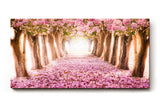 Sinus Art Wandbild 120x80cm Märchenhafter Weg unter rosa Blütenbäumen mit Perspektive und Tiefe
