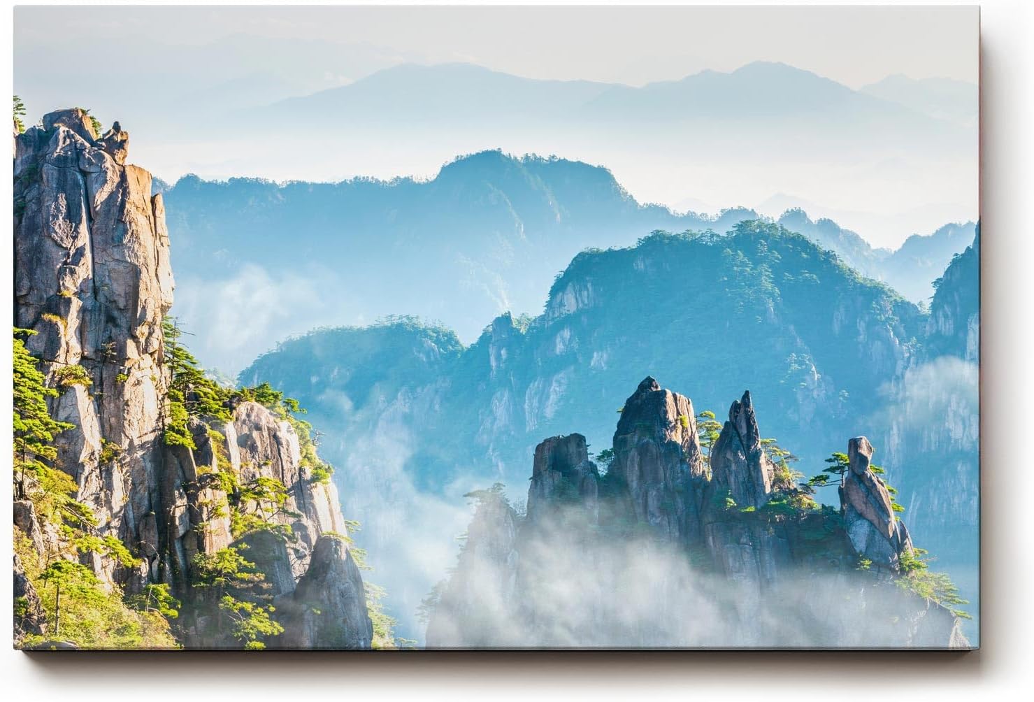 Sinus Art Wandbild 120x80cm Zerklüftete Bergformationen im Nebelmeer für eine ruhige und geheimnisvolle Raumwirkung