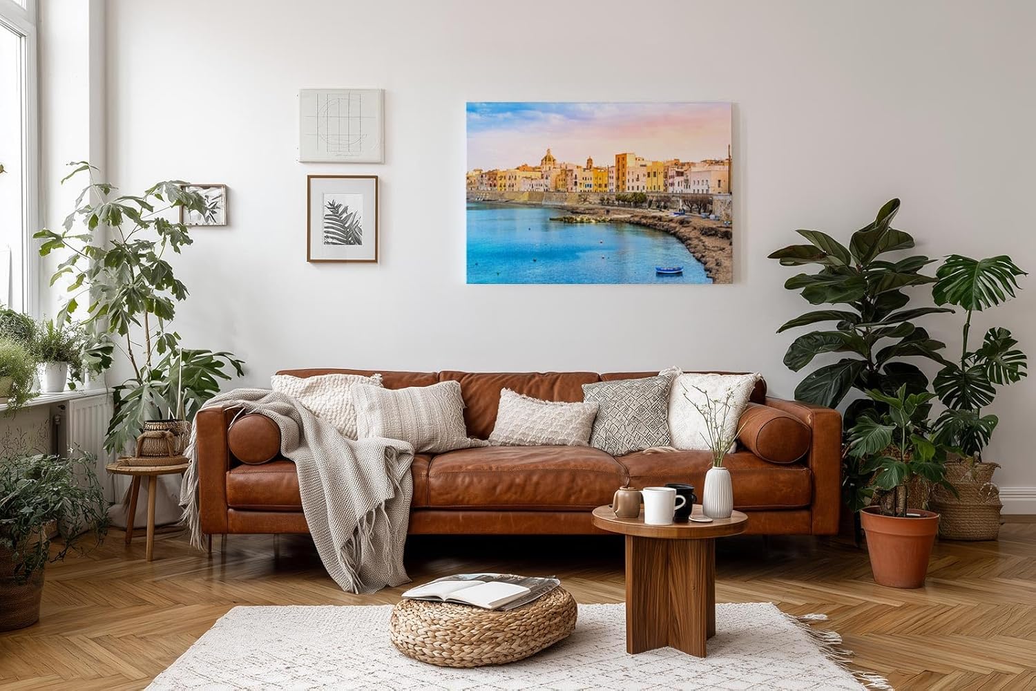 Sinus Art Wandbild 120x80cm Pastellfarbene Häuserzeile an der Küste vor türkisblauem Meer – mediterranes Flair pur