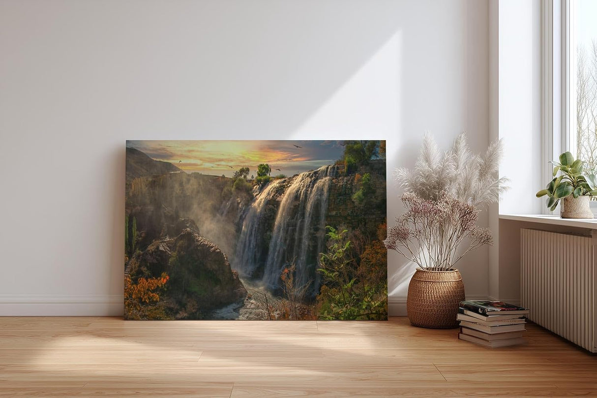Sinus Art Wandbild 120x80cm Wasserfall-Szenerie im warmen Licht des Sonnenuntergangs mit lebendiger Vegetation