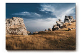 Sinus Art Wandbild 120x80cm Markante Felsformationen unter blauem Himmel in dramatischer Weite