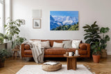 Sinus Art Wandbild 120x80cm Beeindruckendes Panorama mit schneebedeckten Gipfeln und grünen Hängen im Vordergrund
