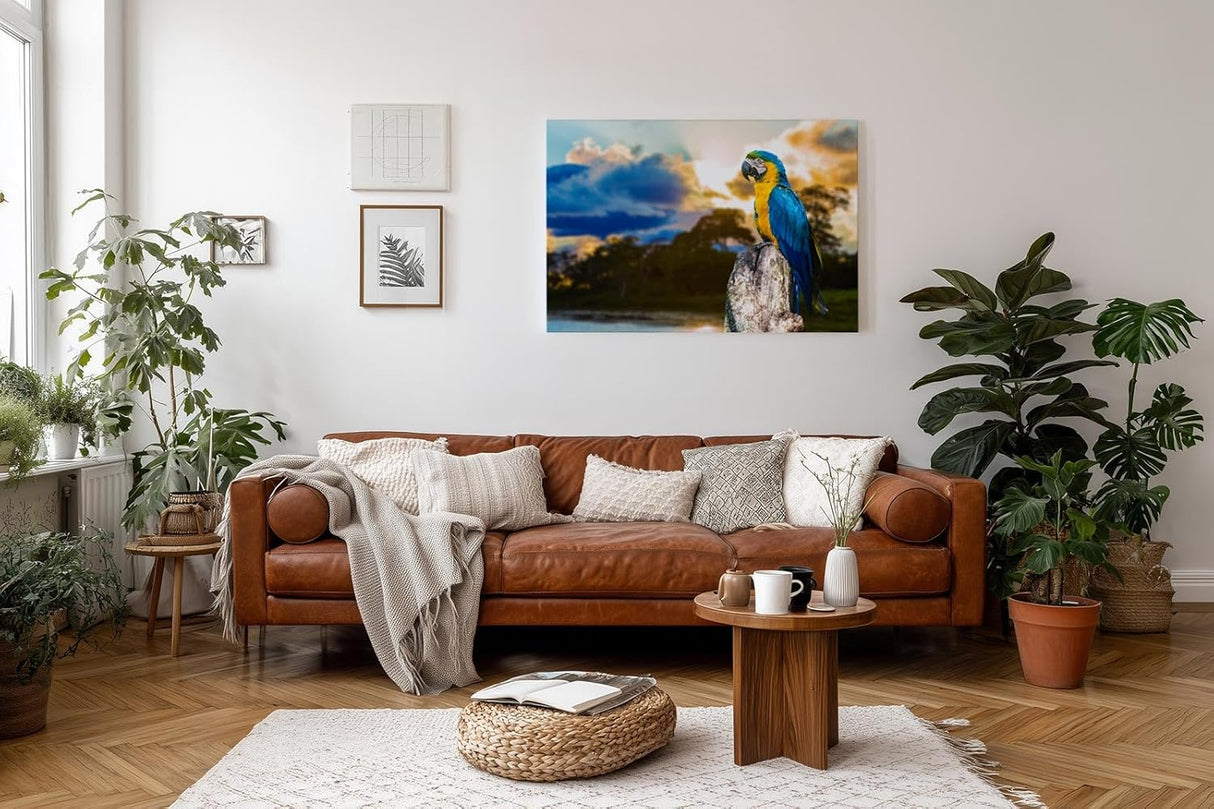Sinus Art Wandbild 120x80cm Farbenfroher Ara auf Baumstamm mit stimmungsvoller Himmelsszenerie in der Natur