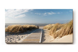 Sinus Art Wandbild 120x80cm Idyllischer Holzsteg durch Dünenlandschaft unter blauem Himmel bis zum Meer