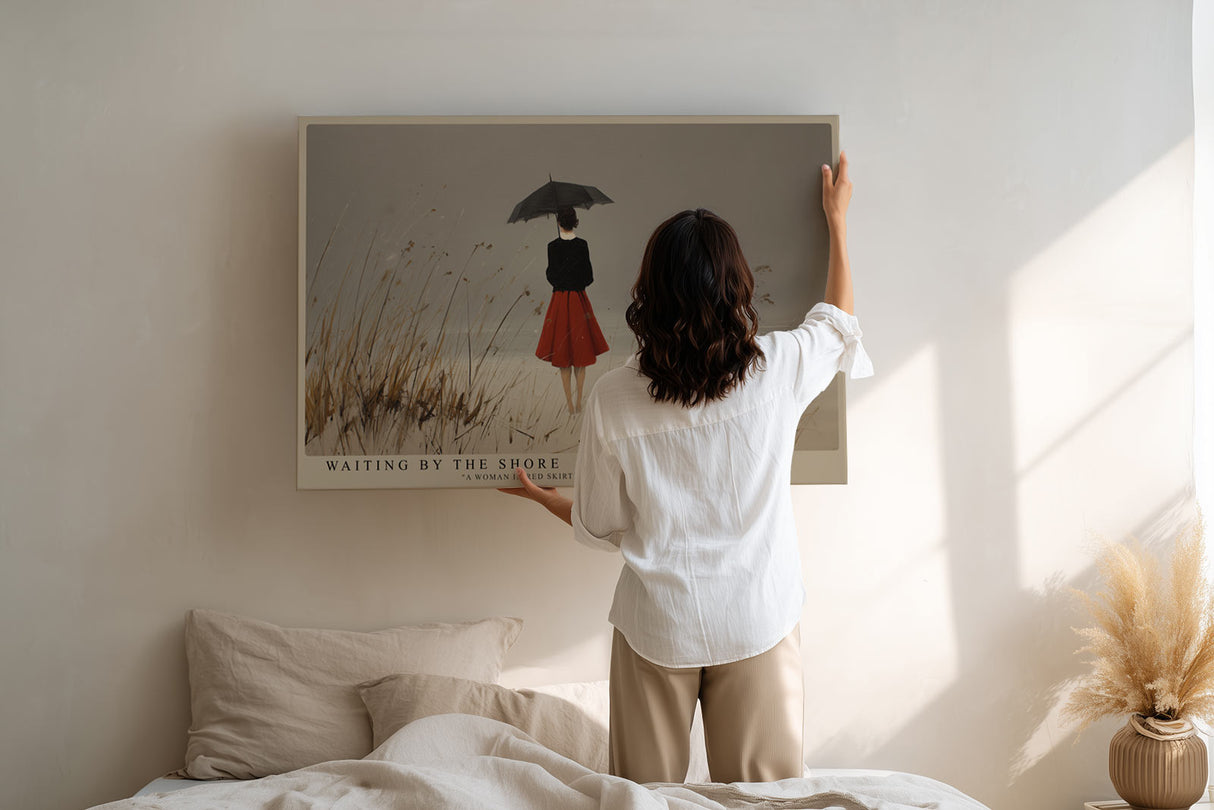 Paul Sinus Wandbild Waiting by the Shore – Die Frau am grauen Strand mit rotem Rock