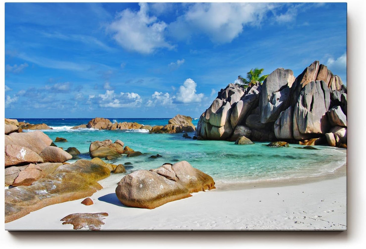 Sinus Art Wandbild 120x80cm Türkises Wasser, weißer Sand und markante Felsen – Urlaubsstimmung pur auf Leinwand