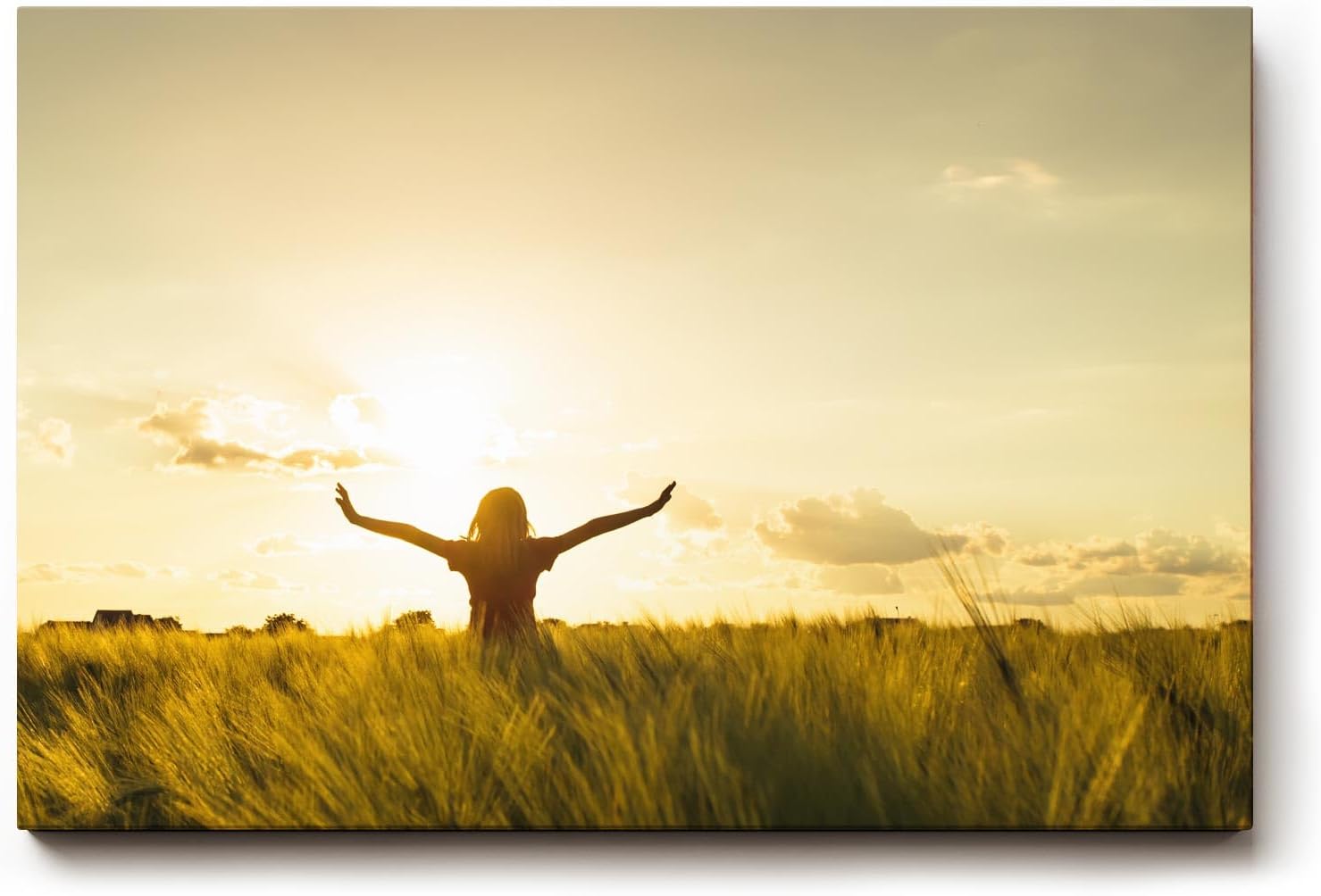 Sinus Art Wandbild 120x80cm Stimmungsvolle Silhouette einer Frau mit erhobenen Armen in einem goldenen Weizenfeld