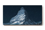 Sinus Art Wandbild 120x80cm Silbrig schimmernder Gipfel des Matterhorns vor dunklem Nachthimmel
