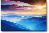 Sinus Art Wandbild 120x80cm Faszinierende Berglandschaft in verschiedenen Blauabstufungen mit goldener Sonne