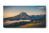 Sinus Art Wandbild 120x80cm Alpenmassiv im goldenen Licht des Sonnenaufgangs über grünen Hügeln