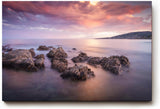 Sinus Art Wandbild 120x80cm Sanfte Wellen, Felsen im Wasser und ein farbintensiver Abendhimmel schaffen Harmonie und Weite