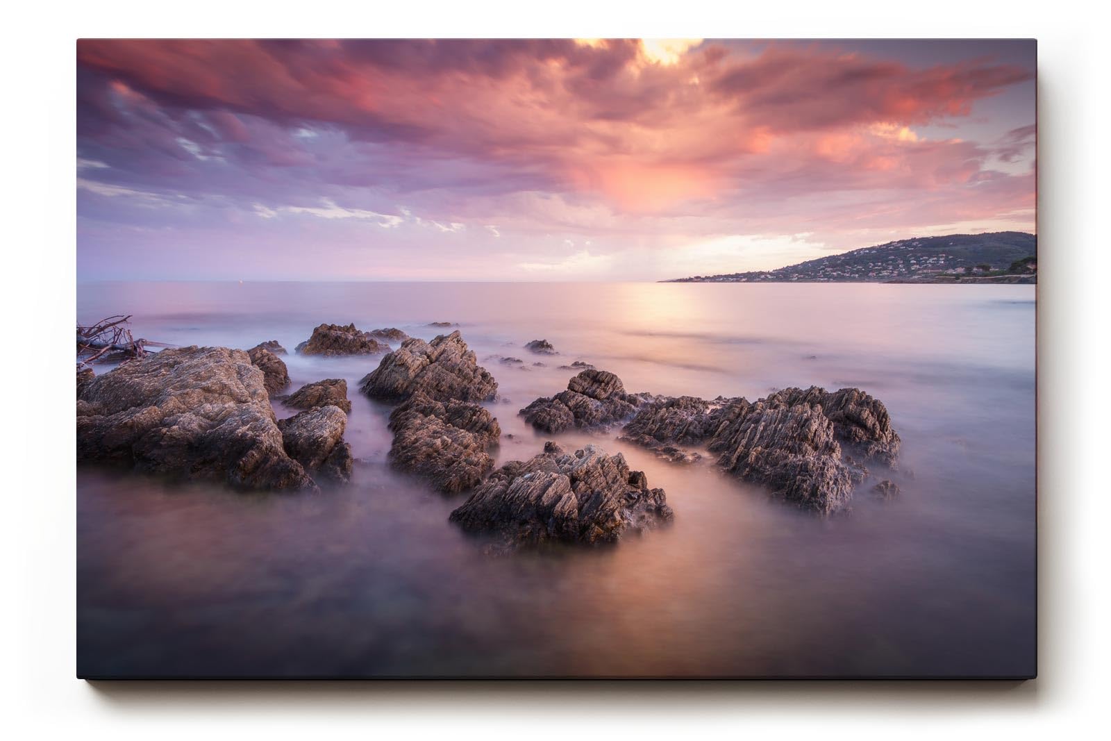 Sinus Art Wandbild 120x80cm Sanfte Wellen, Felsen im Wasser und ein farbintensiver Abendhimmel schaffen Harmonie und Weite