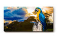 Sinus Art Wandbild 120x80cm Farbenfroher Ara auf Baumstamm mit stimmungsvoller Himmelsszenerie in der Natur