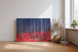 Sinus Art Wandbild 120x80cm Kontrastreiches Bild mit blau-grauen Baumstämmen und leuchtend rotem Waldboden