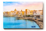 Sinus Art Wandbild 120x80cm Pastellfarbene Häuserzeile an der Küste vor türkisblauem Meer – mediterranes Flair pur