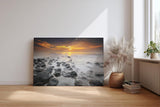 Sinus Art Wandbild 120x80cm Ruhiges Küstenmotiv mit Felsen im Wasser und goldenem Sonnenuntergang