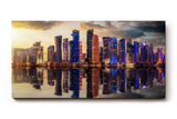 Sinus Art Wandbild 120x80cm Moderne Skyline spiegelt sich im Wasser bei untergehender Sonne – urbanes Highlight