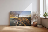 Sinus Art Wandbild 120x80cm Faszinierendes Motiv eines Leuchtturms auf strukturierten Felsen im Abendlicht