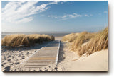Sinus Art Wandbild 120x80cm Idyllischer Holzsteg durch Dünenlandschaft unter blauem Himmel bis zum Meer