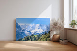 Sinus Art Wandbild 120x80cm Beeindruckendes Panorama mit schneebedeckten Gipfeln und grünen Hängen im Vordergrund