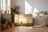 Sinus Art Wandbild 120x80cm Stimmungsvolle Silhouette einer Frau mit erhobenen Armen in einem goldenen Weizenfeld