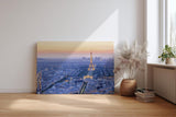 Sinus Art Wandbild 120x80cm Der leuchtende Eiffelturm inmitten der Stadt sorgt für Eleganz und Fernweh im Raum