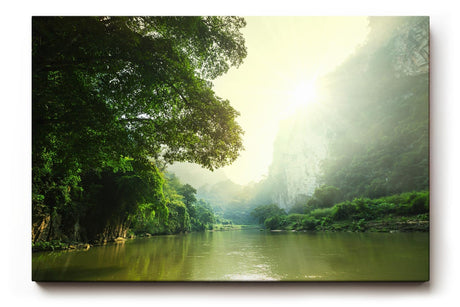 Sinus Art Wandbild 120x80cm Stimmungsvoller Flusslauf im Tal mit Sonnenaufgang und dichter Vegetation