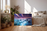 Sinus Art Wandbild 120x80cm Mystische Felsenküste bei Nacht unter violettem Himmel mit leuchtendem Wasser