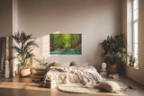Sinus Art Wandbild 120x80cm Friedlicher Fluss mit glasklarem Wasser inmitten eines grünen Laubwaldes