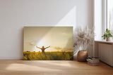Sinus Art Wandbild 120x80cm Stimmungsvolle Silhouette einer Frau mit erhobenen Armen in einem goldenen Weizenfeld