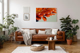 Sinus Art Wandbild 120x80cm Makroaufnahme leuchtend orangefarbener Blütenblätter mit funkelnden Wassertropfen