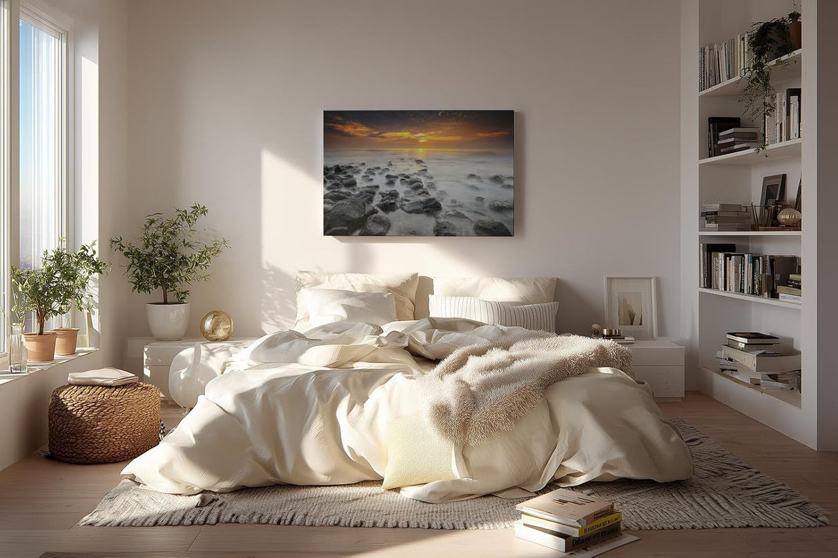 Sinus Art Wandbild 120x80cm Ruhiges Küstenmotiv mit Felsen im Wasser und goldenem Sonnenuntergang