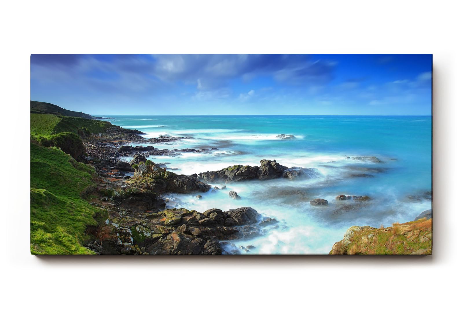 Sinus Art Wandbild 120x80cm Felsige Küste trifft auf türkisfarbenes Meer unter dramatischem Himmel