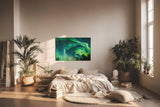 Sinus Art Wandbild 120x80cm Atemberaubende Aurora Borealis mit dynamischem Farbspiel über Silhouetten dunkler Bäume
