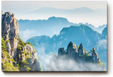 Sinus Art Wandbild 120x80cm Zerklüftete Bergformationen im Nebelmeer für eine ruhige und geheimnisvolle Raumwirkung
