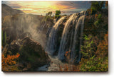 Sinus Art Wandbild 120x80cm Wasserfall-Szenerie im warmen Licht des Sonnenuntergangs mit lebendiger Vegetation