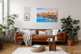 Sinus Art Wandbild 120x80cm Pastellfarbene Häuserzeile an der Küste vor türkisblauem Meer – mediterranes Flair pur