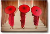 Sinus Art Wandbild 120x80cm Drei Mönche mit traditionellen Schirmen in rhythmischer Komposition