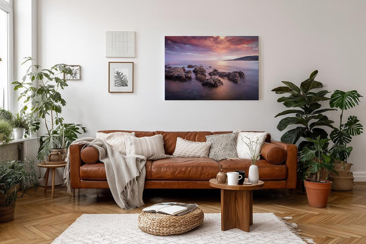 Sinus Art Wandbild 120x80cm Sanfte Wellen, Felsen im Wasser und ein farbintensiver Abendhimmel schaffen Harmonie und Weite