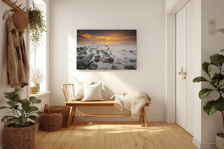 Sinus Art Wandbild 120x80cm Ruhiges Küstenmotiv mit Felsen im Wasser und goldenem Sonnenuntergang