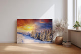 Sinus Art Wandbild 120x80cm Schneebedeckter Nadelwald im Morgenlicht – intensiv, leuchtend und ruhig zugleich