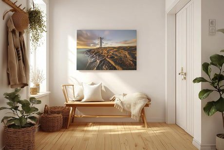 Sinus Art Wandbild 120x80cm Faszinierendes Motiv eines Leuchtturms auf strukturierten Felsen im Abendlicht