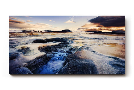 Sinus Art Wandbild 120x80cm Faszinierende isländische Lavalandschaft mit Geysiren, Felsen und dramatischem Himmel