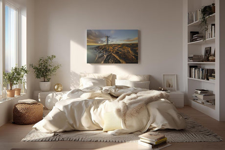 Sinus Art Wandbild 120x80cm Faszinierendes Motiv eines Leuchtturms auf strukturierten Felsen im Abendlicht